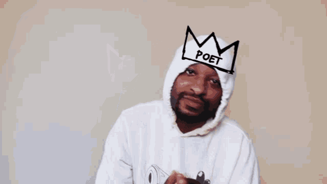 a man wearing a hoodie with a crown on his head is playing with me !