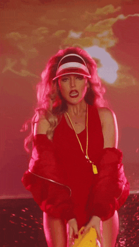 a woman in a red swimsuit is wearing a yellow lifeguard whistle
