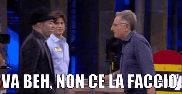 three men standing next to each other with va beh non ce la faccio