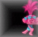 a troll doll is standing in a dark room with a black background .
