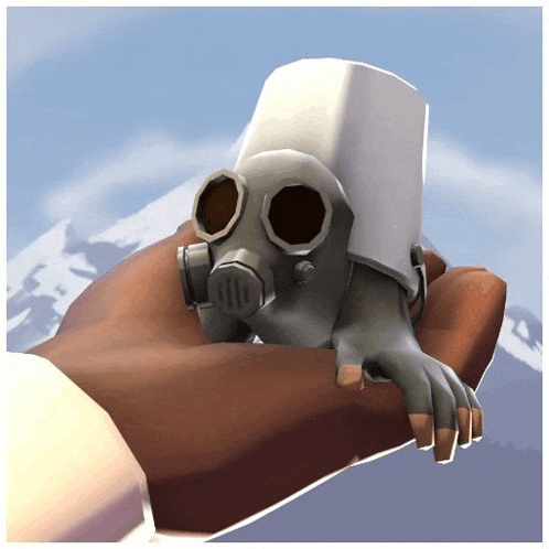 a person is holding a gas mask in their hand with mountains in the background