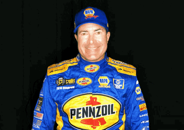 a man wearing a napa hat and pennzoil shirt