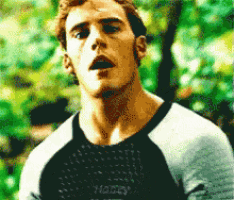 a man wearing a black shirt with the word honey on it