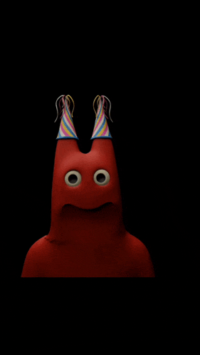a red cartoon character wearing a party hat is sticking his tongue out