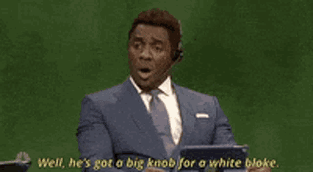 a man in a suit and tie says well he 's got a big knob for a white bloke .