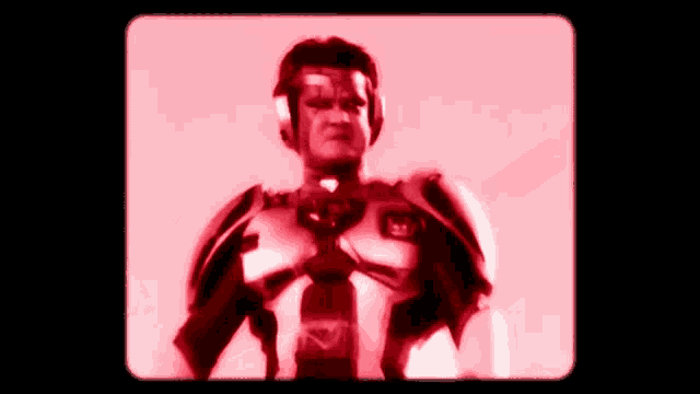a man in a robot costume with a x on his chest