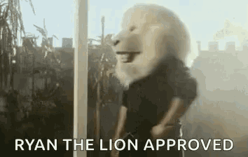 a man wearing a lion mask is standing in front of a window with the words `` ryan the lion approved '' .