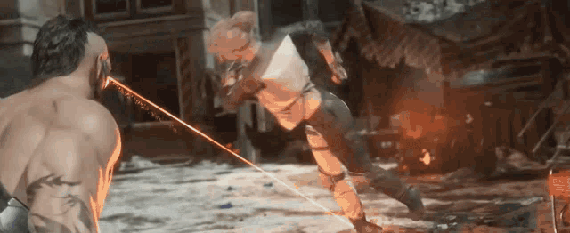 a man and a woman are fighting in a video game with a laser beam coming out of their eyes .