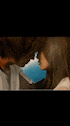 a man and a woman are kissing each other in a room .
