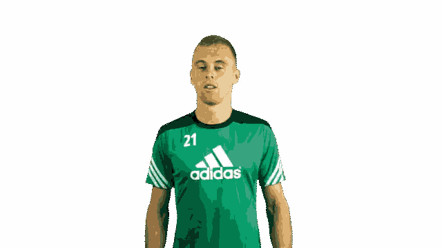 a man is wearing a green adidas shirt with the number 21 on it