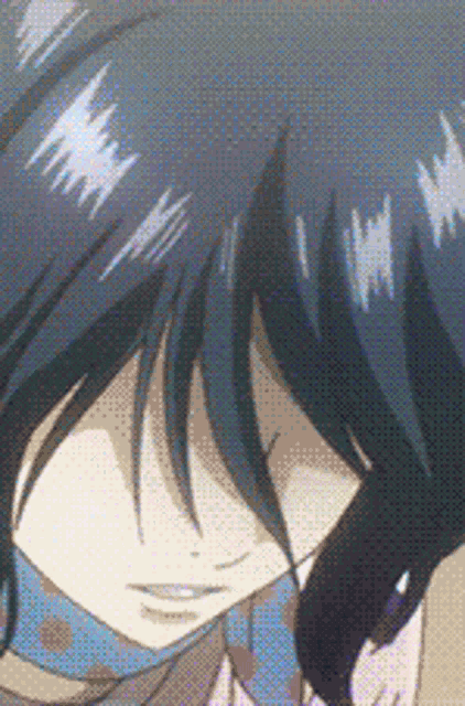 a close up of a person 's face with dark hair