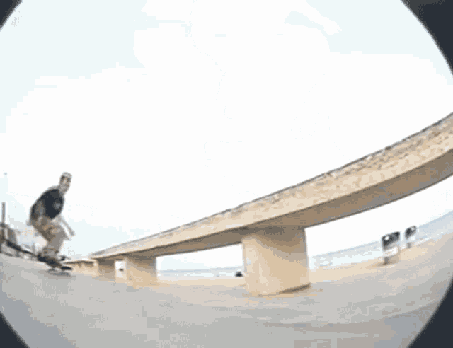 a skateboarder is doing a trick on a railing while wearing a shirt that says " jesus "