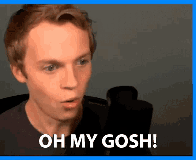 a man is talking into a microphone and saying oh my gosh !