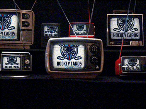 a group of hockey cards televisions are lined up on a table
