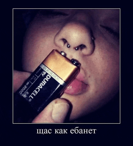 a person is holding a duracell battery in their nose