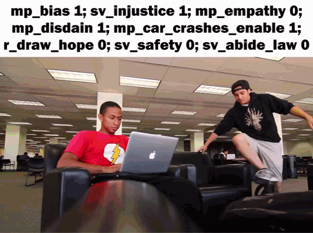 a man in a red shirt with a lightning bolt on it sits at a table with an apple laptop