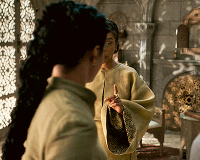 two women are standing next to each other and one is wearing a ring