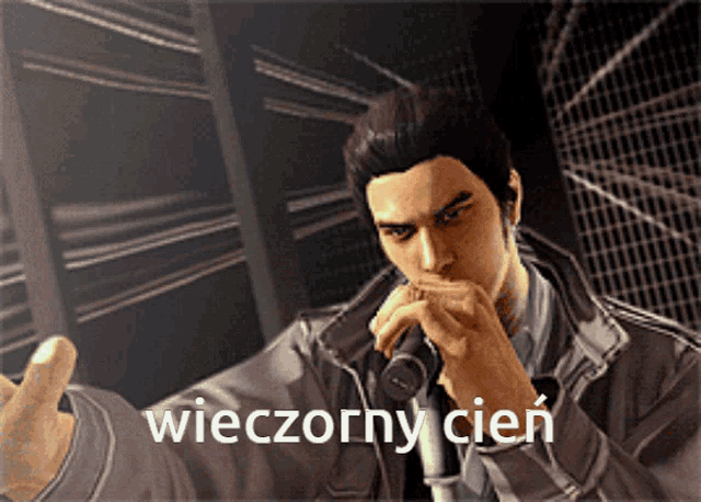 a man singing into a microphone with the word wieczorny cien written below him