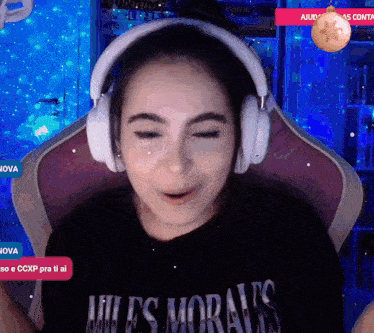 a woman wearing headphones and a shirt that says miles morales on it