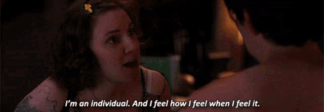 a woman is talking to a shirtless man and says i 'm an individual