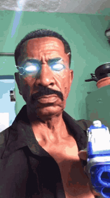 a man with a mustache and glasses holds a toy gun