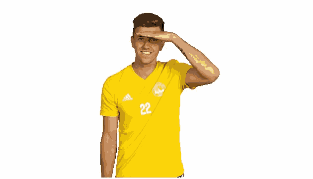 a man wearing a yellow shirt with the number 22 on the front