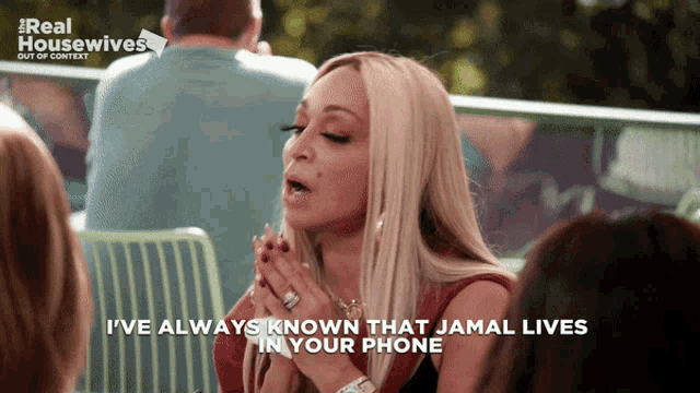 a woman says " i 've always known that jamal lives in your phone " in front of a group of people