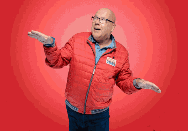 a man in a red jacket has a name tag that says ' donald trump '