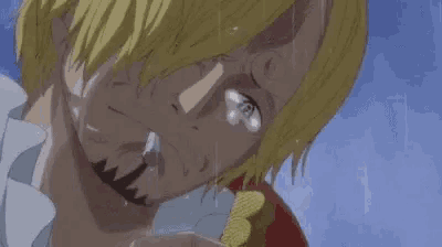 a close up of a person 's face with a tear coming out of his eye .
