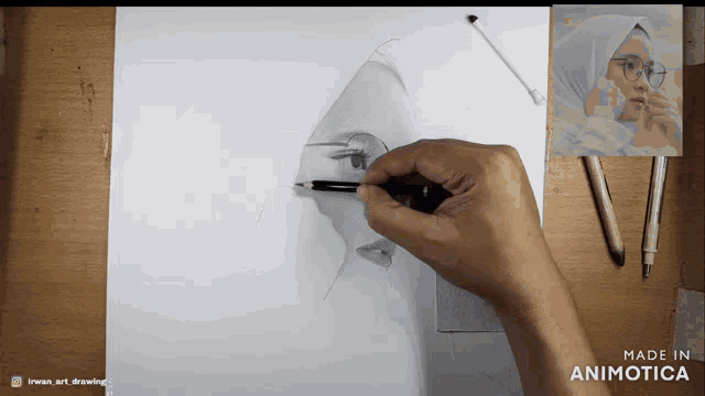 a person is drawing a woman 's face with a pencil on a piece of paper that says made in animatica