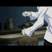 a man in a white shirt is using a coffee grinder in a kitchen