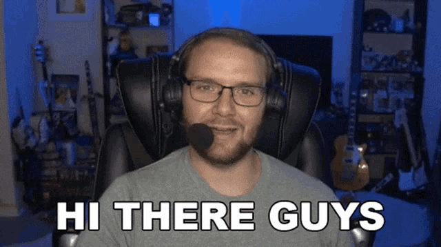a man wearing glasses and headphones says hi there guys