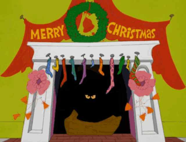 a merry christmas sign hangs over a fireplace with stockings hanging from it