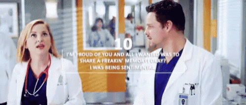 a man and a woman are standing next to each other in a hospital room with the number 10 on the bottom