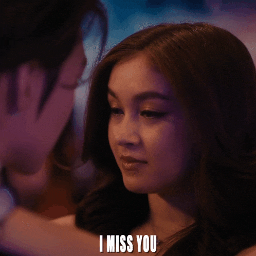 a close up of a woman 's face with the words i miss you below it