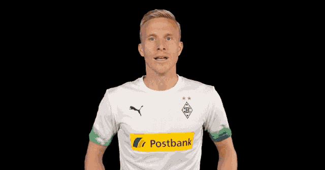 a man in a white and green postbank shirt