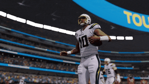 a football player with the number 10 on his jersey is running with the ball