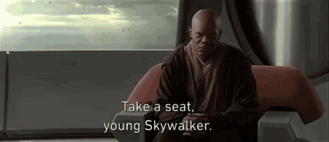 a man is sitting in a chair with the words `` take a seat , young skywalker '' .