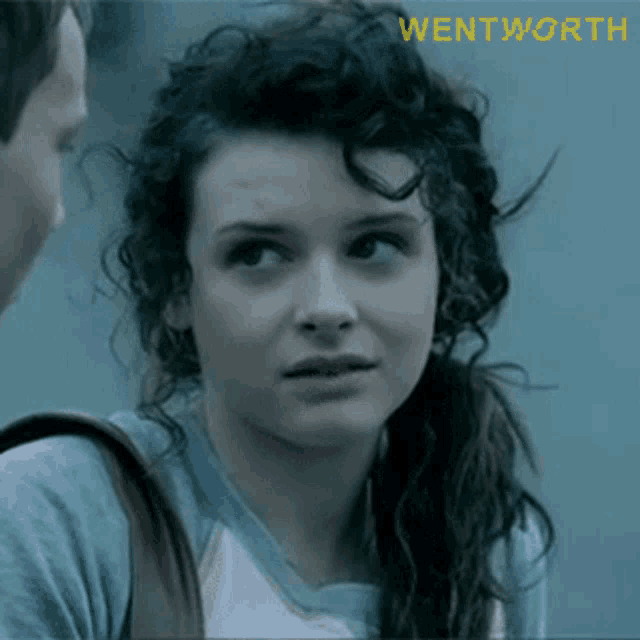 a close up of a woman 's face with the word wentworth on the bottom right
