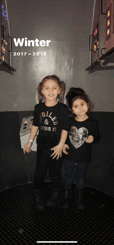 two little girls standing next to each other in a room with the words winter 2017 - 2018