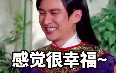 a man with long hair is smiling and making a funny face in a foreign language .