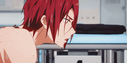a close up of a person with red hair and sweat coming out of them