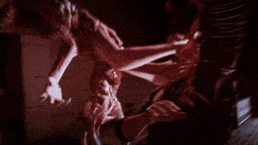 a bloody scene in a hallway with the letters cc visible on the cabinets