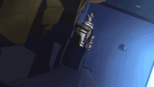 a person in a blue glove holds a trophy in their hand