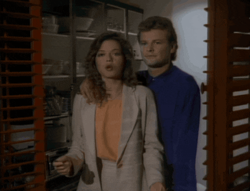 a man and a woman standing next to each other