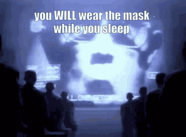 a group of people are looking at a screen which says you will wear the mask while you sleep