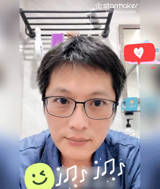 a man wearing glasses and a smiley face is being created by starmaker