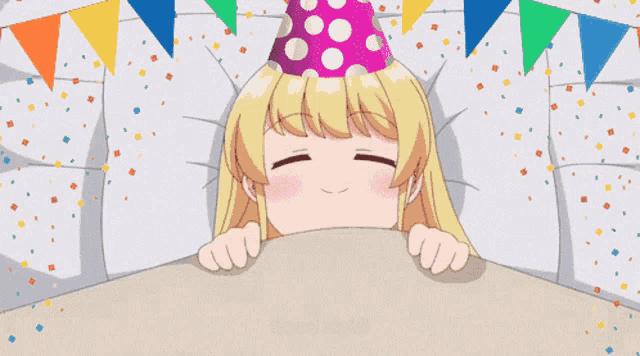 a girl wearing a party hat is sleeping in a bed