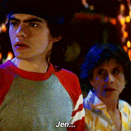 a man and a woman are standing next to each other and the man is saying " jen "