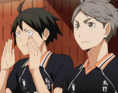 a couple of anime characters with chinese writing on their uniforms